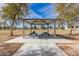 Outdoor park pavilion featuring picnic tables on a sunny day with blue sky at 1938 E Myrna Ln, Tempe, AZ 85284