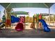 Community playground with colorful slides and covered shade structures for the neighborhood at 1938 E Myrna Ln, Tempe, AZ 85284