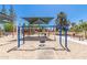 Community playground featuring swings with covered play areas and picnic tables for families at 1938 E Myrna Ln, Tempe, AZ 85284