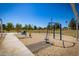 Community playground with swings and play equipment near picnic tables, perfect for outdoor fun at 1938 E Myrna Ln, Tempe, AZ 85284