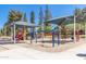 Outdoor playground featuring shaded structures and colorful play equipment for enjoyment at 1938 E Myrna Ln, Tempe, AZ 85284