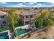 Aerial view showcases the backyard living space, pool, and landscaping of this meticulously maintained home at 22206 N 36Th Way, Phoenix, AZ 85050