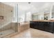 A full bathroom featuring double sinks, glass shower, bathtub, and tile flooring at 22206 N 36Th Way, Phoenix, AZ 85050