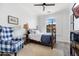 Charming bedroom with a four-poster bed, accent chair, and sunny window view at 22206 N 36Th Way, Phoenix, AZ 85050