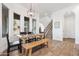 Inviting dining area with natural light, wood floors, and staircase at 22206 N 36Th Way, Phoenix, AZ 85050