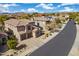 An eye-level view of a two-story home featuring desert landscaping and a clay tile roof at 22206 N 36Th Way, Phoenix, AZ 85050