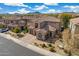 A two-story home with clay tile roof and desert landscaping in a sunny neighborhood at 22206 N 36Th Way, Phoenix, AZ 85050