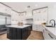 Beautiful kitchen featuring white cabinets, a large island, and stainless steel appliances at 22206 N 36Th Way, Phoenix, AZ 85050