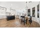 Bright, open-concept kitchen with white cabinetry, dark island, and wood floors at 22206 N 36Th Way, Phoenix, AZ 85050