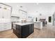 Open-concept kitchen with stainless steel appliances, a large island, and views into the living room at 22206 N 36Th Way, Phoenix, AZ 85050