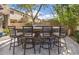 Outdoor kitchen features a built-in grill and bar seating, ideal for entertaining and outdoor dining at 22206 N 36Th Way, Phoenix, AZ 85050