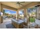 Inviting outdoor patio with a modern fire pit, comfortable seating, and a well-manicured lawn at 22206 N 36Th Way, Phoenix, AZ 85050