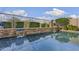 A swimming pool's water feature adds a touch of elegance to the outdoor space with lush landscaping at 22206 N 36Th Way, Phoenix, AZ 85050