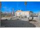 Fenced backyard featuring a table, patio umbrella, and scattered debris at 2237 E Windsor Ave, Phoenix, AZ 85006