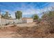 A view of the backyard showing a yard that needs care and an outbuilding at 2237 E Windsor Ave, Phoenix, AZ 85006