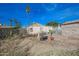 A view of the backyard showing a yard that needs care and an outbuilding at 2237 E Windsor Ave, Phoenix, AZ 85006