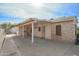 View of back of house showing covered patio and stone exterior at 2237 E Windsor Ave, Phoenix, AZ 85006