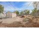 A view of the backyard showing a yard that needs care and an outbuilding at 2237 E Windsor Ave, Phoenix, AZ 85006