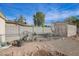 A view of the backyard showing a yard that needs care and a block wall at 2237 E Windsor Ave, Phoenix, AZ 85006