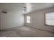 A vacant bedroom showcasing natural light and a ceiling fan at 2237 E Windsor Ave, Phoenix, AZ 85006