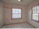 Bedroom with two windows featuring blinds and tile floor at 2237 E Windsor Ave, Phoenix, AZ 85006