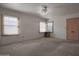 Empty living room showcasing natural light from multiple windows at 2237 E Windsor Ave, Phoenix, AZ 85006