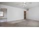 Cozy living room with neutral carpet and ceiling fan, ready for your personal touch at 2237 E Windsor Ave, Phoenix, AZ 85006