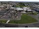 An aerial view of the community, highlighting the parking area, pool, and tennis courts at 25236 S Lakeway Dr, Sun Lakes, AZ 85248