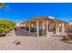 Covered patio with seating overlooks a low maintenance rock yard, with a lattice covering for shade at 25236 S Lakeway Dr, Sun Lakes, AZ 85248