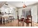 Bright dining area featuring a glass table, decorative chairs, and access to the patio at 25236 S Lakeway Dr, Sun Lakes, AZ 85248