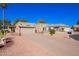 Desert-landscaped single-story home featuring an attached garage and well-maintained yard at 25236 S Lakeway Dr, Sun Lakes, AZ 85248