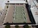 Aerial view of community shuffleboard area with multiple courts ready for play at 25236 S Lakeway Dr, Sun Lakes, AZ 85248