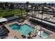 Aerial view of the community pool area with hot tub, lounge chairs and lush landscaping at 25236 S Lakeway Dr, Sun Lakes, AZ 85248