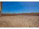 Expansive, fully-enclosed backyard with dirt landscaping ready for customization at 25372 N 158Th Ct, Surprise, AZ 85387