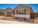 Beautiful single-story home featuring desert landscaping, a tile roof, and a two-car garage at 25372 N 158Th Ct, Surprise, AZ 85387