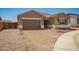 Lovely home with paver driveway and a desert landscaped yard, enhancing its curb appeal at 25372 N 158Th Ct, Surprise, AZ 85387