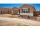 Charming single-story home with a two-car garage, neutral color palette, and low-maintenance desert landscaping at 25372 N 158Th Ct, Surprise, AZ 85387
