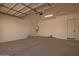 Spacious garage with ample room for multiple vehicles and storage and features an electric garage door at 25372 N 158Th Ct, Surprise, AZ 85387