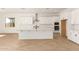 Spacious kitchen with a center island, white cabinetry, stainless steel appliances, and ample counter space for cooking at 25372 N 158Th Ct, Surprise, AZ 85387