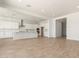 Open-concept living space featuring neutral color palette, recessed lighting, and tile flooring throughout the main living areas at 25372 N 158Th Ct, Surprise, AZ 85387