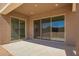 Covered patio perfect for outdoor living, with access to the home through sliding glass doors at 25372 N 158Th Ct, Surprise, AZ 85387
