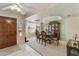 Elegant dining space with chandelier lighting, and a view of the front entry at 2558 E Inglewood St, Mesa, AZ 85213