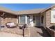 Cozy front porch with brick accents, outdoor seating, and a secure screen door entrance at 2558 E Inglewood St, Mesa, AZ 85213