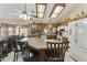 Bright kitchen featuring an island with seating, granite countertops, and ample cabinet space at 2558 E Inglewood St, Mesa, AZ 85213