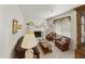 Cozy living room showcasing a fireplace, neutral tones, and comfortable seating arrangement at 2558 E Inglewood St, Mesa, AZ 85213