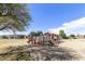 Community playground with slides and climbing equipment in a well-maintained park setting at 2558 E Inglewood St, Mesa, AZ 85213