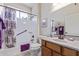 Updated bathroom with oak vanity, tiled floor, a shower-tub combo, and vanity mirror at 2662 S Springwood Blvd # 461, Mesa, AZ 85209