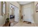 Welcoming entryway with tiled floor, coat rack, and an open view into the living room at 2662 S Springwood Blvd # 461, Mesa, AZ 85209