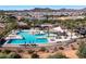 Aerial view of community pool, BBQ, lounge chairs, shade structures, and residential neighborhood at 2843 E Los Gatos Dr, Phoenix, AZ 85050