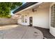 Home's back exterior features an artificial lawn, desert landscaping, and fenced yard at 328 E Ivy St, Mesa, AZ 85201